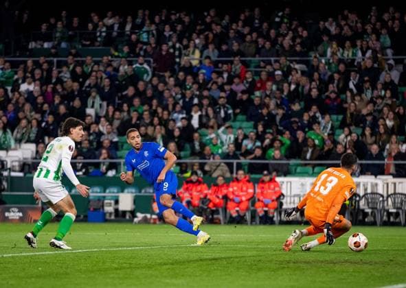 Rangers Forward Cyriel Dessers scores his sides second goal during the Europa League Group C match at the Estadio Benito Villamarin, Seville. Real Betis v Rangers, UEFA Europa League, Group C, Football, Benito VillamaroÆ?Ã?Ân Stadium, Seville, Spain - 14 Dec 2023 EDITORIAL USE ONLY No use with unauthorised audio, video, data, fixture lists, club league logos or live services. Online in-match use limited to 120 images, no video emulation. No use in betting, games or single club league player publications. Copyright: xKirkxO Rourke RangersxFC Shutterstockx 14257803bk