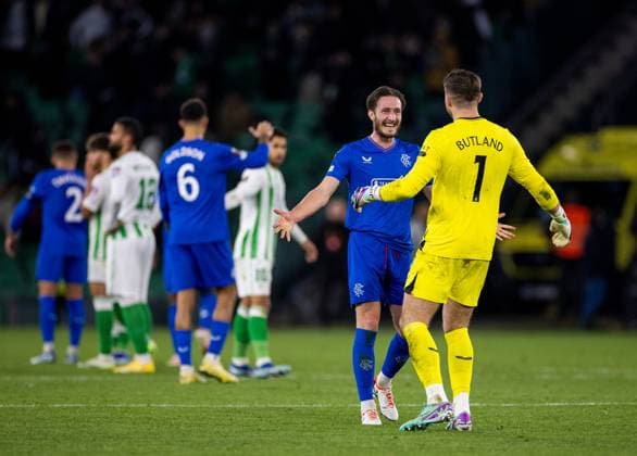 Rangers Defender Ben Davies celebrates with Rangers Goalkeeper Jack Butland during the Europa League Group C match at the Estadio Benito Villamarin, Seville. Real Betis v Rangers, UEFA Europa League, Group C, Football, Benito VillamaroÆ?Ã?Ân Stadium, Seville, Spain - 14 Dec 2023 EDITORIAL USE ONLY No use with unauthorised audio, video, data, fixture lists, club league logos or live services. Online in-match use limited to 120 images, no video emulation. No use in betting, games or single club league player publications. Copyright: xKirkxO Rourke RangersxFC Shutterstockx 14257803gg