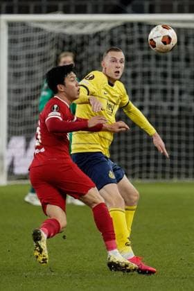 Gustaf Nilsson of Royal Union Saint-Gilloise and Wataru Endo of Liverpool Union Saint-Gilloise v Liverpool, UEFA Europa League, Group E, Football, Lotto Park, Brussels, Belgium - 14 Dec 2023 EDITORIAL USE ONLY No use with unauthorised audio, video, data, fixture lists, club league logos or live services. Online in-match use limited to 120 images, no video emulation. No use in betting, games or single club league player publications. Copyright: xDavexWinter Shutterstockx 14254246es