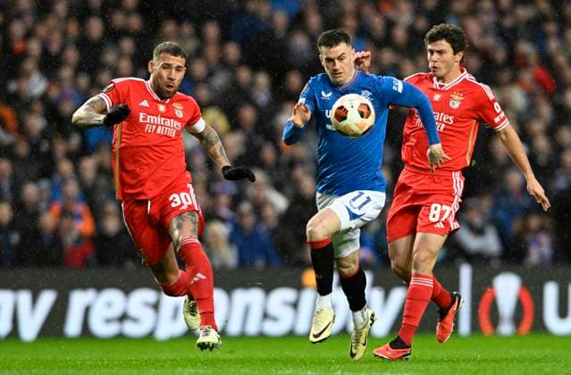 Glasgow, Scotland, 14th March 2024. Nicol‡s Otamendi of Benfica, Tom Lawrence of Rangers and Jo‹o Neves of Benfica during the UEFA Europa League Round of 16 match at Ibrox Stadium, Glasgow. Picture credit should read: Neil Hanna Sportimage EDITORIAL USE ONLY. No use with unauthorised audio, video, data, fixture lists, club league logos or live services. Online in-match use limited to 120 images, no video emulation. No use in betting, games or single club league player publications. SPI-3007-0040