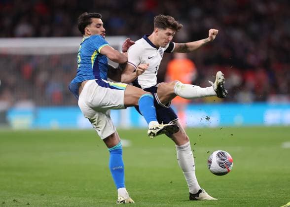 London, England, 23rd March 2024. Lucas Paqueta of Brazil and John Stones of England during the International Friendly, Länderspiel, Nationalmannschaft match at Wembley Stadium, London. Picture credit should read: David Klein Sportimage EDITORIAL USE ONLY. No use with unauthorised audio, video, data, fixture lists, club league logos or live services. Online in-match use limited to 120 images, no video emulation. No use in betting, games or single club league player publications. SPI-3030-0039