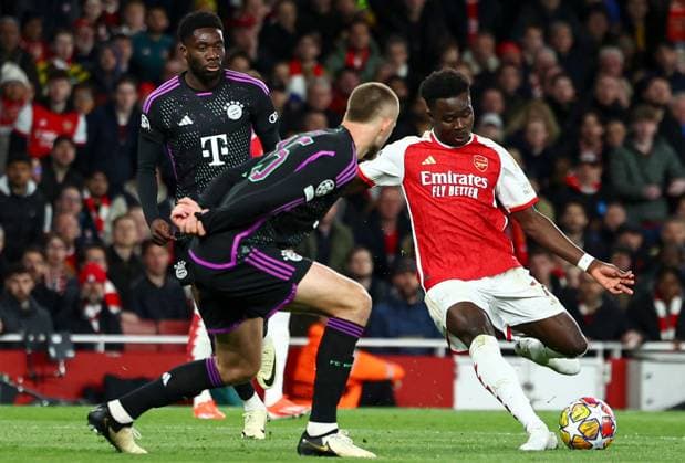 Bukayo Saka of Arsenal scores a goal for their side to make it 1-0 Arsenal v Bayern Munich, UEFA Champions League, Quarter Final, First Leg, Football, Emirates Stadium, London, UK - 09 Apr 2024 EDITORIAL USE ONLY No use with unauthorised audio, video, data, fixture lists, club league logos or live services. Online in-match use limited to 120 images, no video emulation. No use in betting, games or single club league player publications. Copyright: xSimonxDael Shutterstockx 14424047ac