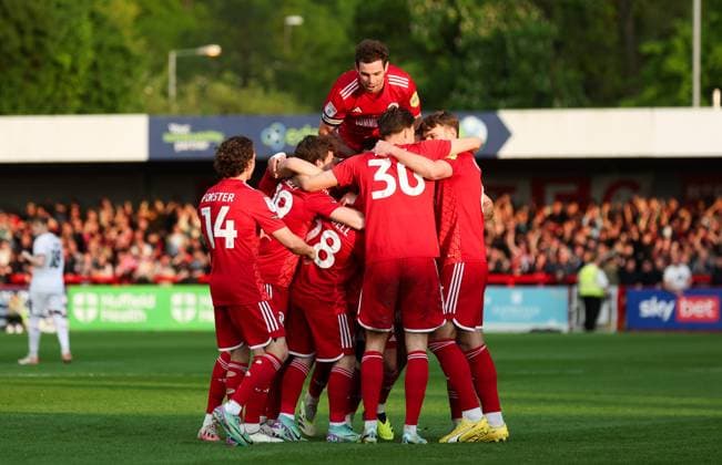 Crawley Town celebrate the opening goal by Liam Kelly of Crawley Town Crawley Town v Milton Keynes Dons, EFL Sky Bet League Two, Play-Off Semi Final, First Leg, Football, Broadfield Stadium, Crawley, UK - 07 May 2024 EDITORIAL USE ONLY No use with unauthorised audio, video, data, fixture lists, club league logos or live services. Online in-match use limited to 120 images, no video emulation. No use in betting, games or single club league player publications. Copyright: xAndrewxFosker Shutterstockx 14467757m