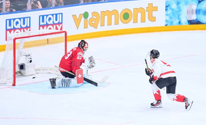 Connor Bedard CAN 98 scores, shoots goal , Tor, Treffer, Torschuss, against Leonardo Genoni Nr. 63 of Switzerland in the penalty shootout of the semi final match CANADA - SWITZERLAND of the IIHF Ice hockey, Eishockey World Championship, WM, Weltmeisterschaft in Prague, Czechia, May 25, 2024, Season 2023 2024