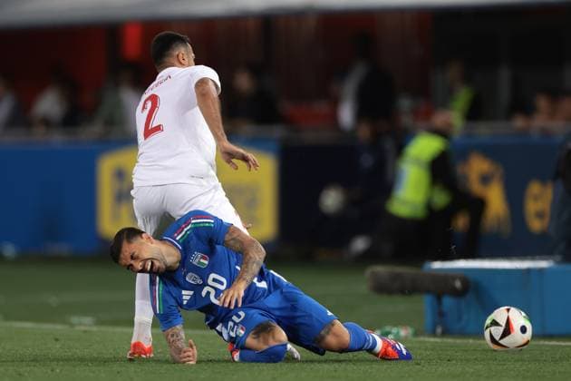 Bologna, Italy, 4th June 2024. Zeki Celik of Turkey goes through the back of Mattia Zaccagni of Italy during the International Friendly, Länderspiel, Nationalmannschaft match at Stadio Renato Dall Ara, Bologna. Picture credit should read: Jonathan Moscrop Sportimage EDITORIAL USE ONLY. No use with unauthorised audio, video, data, fixture lists, club league logos or live services. Online in-match use limited to 120 images, no video emulation. No use in betting, games or single club league player publications. SPI-3179-0047