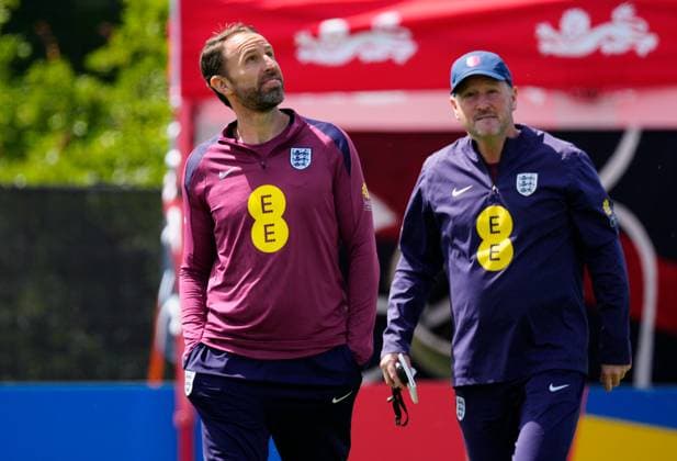 England manager Gareth Southgate, England assistant Steve Holland get caught in the sprinklers England Training Session and press conference, PK, Pressekonferenz UEFA European Championship, EM, Europameisterschaft 2024, Group C, Football, Spa & Golf Resort Weimarer Land, Blankenhain, Germany, 13 Jun 2024 EDITORIAL USE ONLY No use with unauthorised audio, video, data, fixture lists, club league logos or live services. Online in-match use limited to 120 images, no video emulation. No use in betting, games or single club league player publications. Copyright: xDavexShopland Shutterstockx 14523765d
