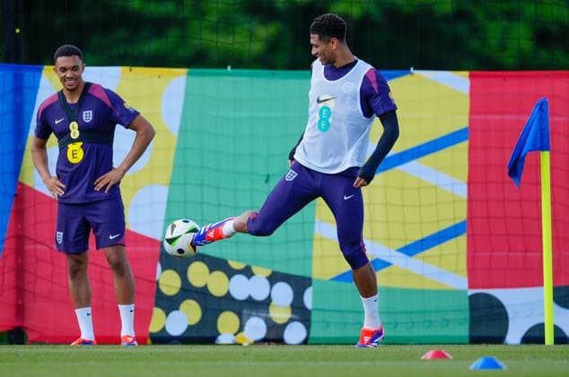 Jude Bellingham watched by Trent Alexander-Arnold of England left England Training Session and press conference, PK, Pressekonferenz UEFA European Championship, EM, Europameisterschaft 2024, Group C, Football, Spa & Golf Resort Weimarer Land, Blankenhain, Germany, 13 Jun 2024 EDITORIAL USE ONLY No use with unauthorised audio, video, data, fixture lists, club league logos or live services. Online in-match use limited to 120 images, no video emulation. No use in betting, games or single club league player publications. Copyright: xDavexShopland Shutterstockx 14523765bf