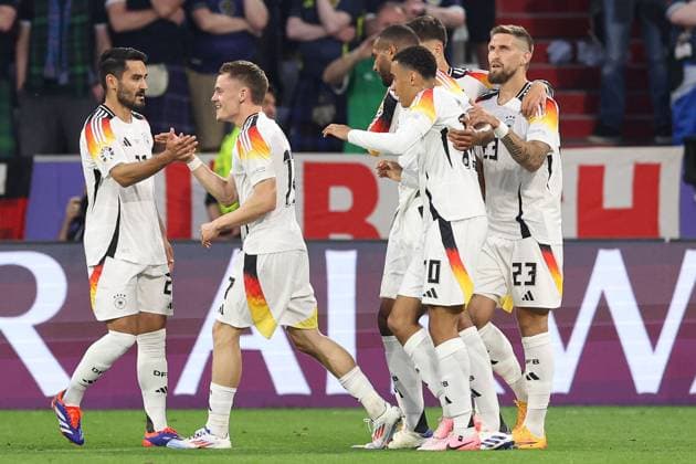 Florian Wirtz of Germany celebrates scoring the goal for their side with their teammates to make it 1-0 Germany v Scotland, UEFA European Championship, EM, Europameisterschaft 2024, Group A, Football, Munich Football Arena, Munich, Germany, 14 Jun 2024 EDITORIAL USE ONLY No use with unauthorised audio, video, data, fixture lists, club league logos or live services. Online in-match use limited to 120 images, no video emulation. No use in betting, games or single club league player publications. Copyright: xPaulxCurrie Shutterstockx 14523776dd