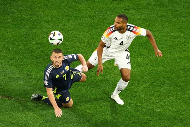 John McGinn of Scotland battles with Jonathan Tah of Germany Germany v Scotland, UEFA European Championship, EM, Europameisterschaft 2024, Group A, Football, Munich Football Arena, Munich, Germany, 14 Jun 2024 EDITORIAL USE ONLY No use with unauthorised audio, video, data, fixture lists, club league logos or live services. Online in-match use limited to 120 images, no video emulation. No use in betting, games or single club league player publications. Copyright: xKieranxMcManus Shutterstockx 14523770bp