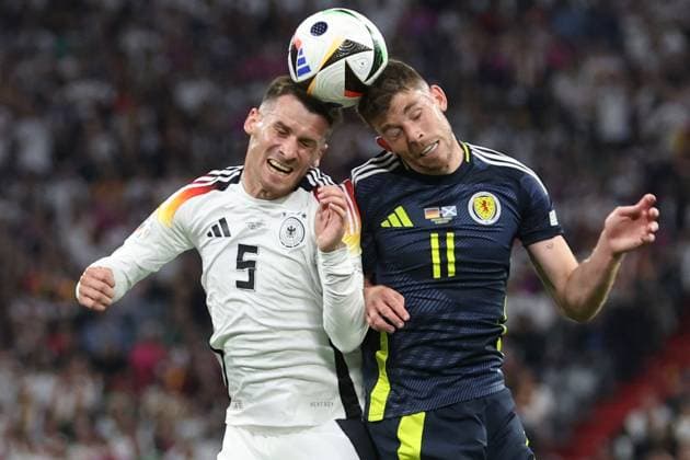 Pascal Groß of Germany (L) battles with Ryan Christie of Scotland (R) in the air Germany v Scotland, UEFA European Championship, EM, Europameisterschaft 2024, Group A, Football, Munich Football Arena, Munich, Germany, 14 Jun 2024 EDITORIAL USE ONLY No use with unauthorised audio, video, data, fixture lists, club league logos or live services. Online in-match use limited to 120 images, no video emulation. No use in betting, games or single club league player publications. Copyright: xPaulxCurrie Shutterstockx 14523776gr