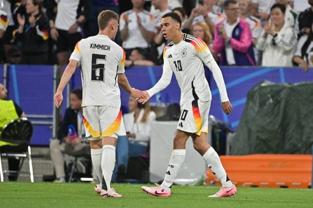 Bild zeigt: Torjubel Deutschland, Joshua Kimmich (6, Deutschland), Jamal Musiala (10, Deutschland), 14.06.2024, München, Fussball, Europameisterschaft, Deutschland - Schottland, EVENT REGULATIONS PROHIBIT ANY USE OF PHOTOGRAPHS AS IMAGE SEQUENCES AND OR QUASI-VIDEO.