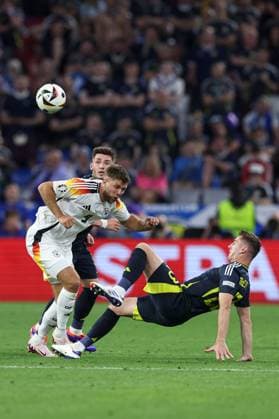 Niclas Füllkrug of Germany is challenged by Kenny McLean of Scotland Germany v Scotland, UEFA European Championship, EM, Europameisterschaft 2024, Group A, Football, Munich Football Arena, Munich, Germany, 14 Jun 2024 EDITORIAL USE ONLY No use with unauthorised audio, video, data, fixture lists, club league logos or live services. Online in-match use limited to 120 images, no video emulation. No use in betting, games or single club league player publications. Copyright: xPaulxCurrie Shutterstockx 14523776ma