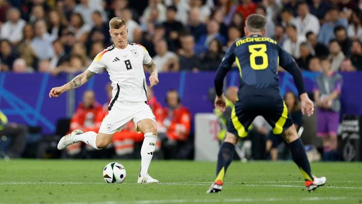 14.06.2024, Fussball, Europameisterschaft, Germany - Scotland, GER, Munich, Munich Football Arena, Bild: v. li. Toni Kroos (Germany, 8) und Callum McGregor (Scotland, 8), Copyright: HMBxMedia xHeikoxBecker