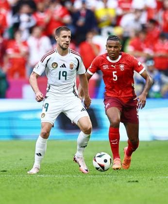 Barnabas Varga of Hungary is pressured by Manuel Akanji of Switzerland Hungary v Switzerland, UEFA European Championship, EM, Europameisterschaft 2024, Group A, Football, Cologne Stadium, Cologne, Germany, 15 Jun 2024 EDITORIAL USE ONLY No use with unauthorised audio, video, data, fixture lists, club league logos or live services. Online in-match use limited to 120 images, no video emulation. No use in betting, games or single club league player publications. Copyright: xMichaelxZemanek Shutterstockx 14539265bh