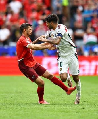Dominik Szoboszlai of Hungary is fouled by Remo Freuler of Switzerland Hungary v Switzerland, UEFA European Championship, EM, Europameisterschaft 2024, Group A, Football, Cologne Stadium, Cologne, Germany, 15 Jun 2024 EDITORIAL USE ONLY No use with unauthorised audio, video, data, fixture lists, club league logos or live services. Online in-match use limited to 120 images, no video emulation. No use in betting, games or single club league player publications. Copyright: xMichaelxZemanek Shutterstockx 14539265bm