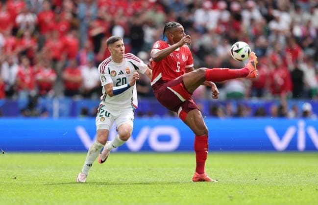 15.06.2024, Fussball Europameisterschaft, UEFA EURO, EM, Europameisterschaft,Fussball 2024, Ungarn - Schweiz, Gruppe A, Köln Stadion, v.l., Roland Sallai (Ungarn), Manuel Akanji (Schweiz) Copyright: HMBxMedia