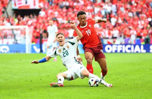 Roland Sallai of Hungary is fouled by Dan Ndoye of Switzerland Hungary v Switzerland, UEFA European Championship, EM, Europameisterschaft 2024, Group A, Football, Cologne Stadium, Cologne, Germany, 15 Jun 2024 EDITORIAL USE ONLY No use with unauthorised audio, video, data, fixture lists, club league logos or live services. Online in-match use limited to 120 images, no video emulation. No use in betting, games or single club league player publications. Copyright: xMichaelxZemanek Shutterstockx 14539265bn