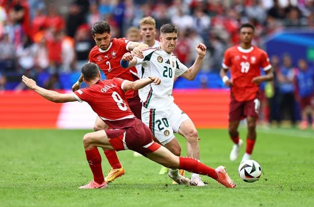 Roland Sallai of Hungary is challenged by Leonidas Stergiou of Switzerland and Remo Freuler of Switzerland Hungary v Switzerland, UEFA European Championship, EM, Europameisterschaft 2024, Group A, Football, Cologne Stadium, Cologne, Germany, 15 Jun 2024 EDITORIAL USE ONLY No use with unauthorised audio, video, data, fixture lists, club league logos or live services. Online in-match use limited to 120 images, no video emulation. No use in betting, games or single club league player publications. Copyright: xMichaelxZemanek Shutterstockx 14539265bw