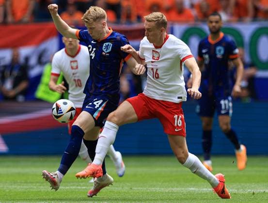 Jerdy Schouten of The Netherlands battles with Adam Buksa of Poland Poland v Netherlands, UEFA European Championship, EM, Europameisterschaft 2024, Group D, Football, Volksparkstadion, Hamburg, Germany, 16 Jun 2024 EDITORIAL USE ONLY No use with unauthorised audio, video, data, fixture lists, club league logos or live services. Online in-match use limited to 120 images, no video emulation. No use in betting, games or single club league player publications. Copyright: xMattxWest Shutterstockx 14539367bx