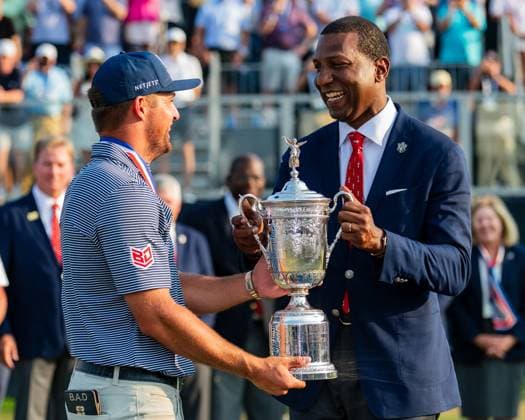 June 16, 2024, Pinehurst, North Carolina, USA: Bryson DeChambeau of Grapevine, Texas, receives the championship trophy from USGA President, Fred Perpall, after winning the 124th U.S. Open, June 16, 2024, at Pinehurst Resort & Country Club (Course No. 2) in Pinehurst, North Carolina. Pinehurst USA - ZUMAh97_ 20240616_fap_h97_023 Copyright: xTimothyxL.xHalex