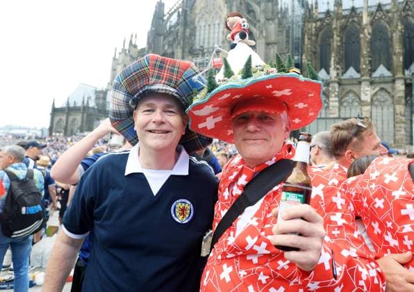 Switzerland and Scotland fans outside Cologne Cathedral ahead of the match Scotland v Switzerland, UEFA European Championship, EM, Europameisterschaft 2024, Group A, Football, Cologne Stadium, Cologne, Germany, 19 Jun 2024 EDITORIAL USE ONLY No use with unauthorised audio, video, data, fixture lists, club league logos or live services. Online in-match use limited to 120 images, no video emulation. No use in betting, games or single club league player publications. Copyright: xMattxWest Shutterstockx 14543656j