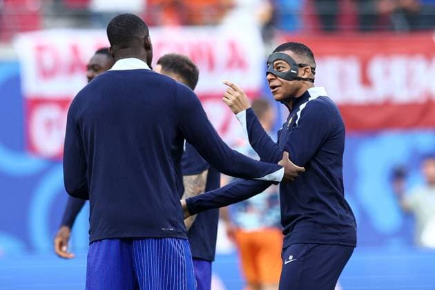 Kylian Mbappà of France wears a face mask during the pre-match warm up after sustaining a broken nose Netherlands v France, UEFA European Championship, EM, Europameisterschaft 2024, Group D, Football, Leipzig Stadium, Leipzig, Germany, 21 Jun 2024 EDITORIAL USE ONLY No use with unauthorised audio, video, data, fixture lists, club league logos or live services. Online in-match use limited to 120 images, no video emulation. No use in betting, games or single club league player publications. Copyright: xMattxWest Shutterstockx 14551682x