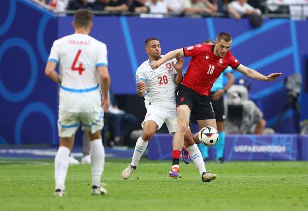 Giorgi Chakvetadze of Georgia is challenged by Ondrej Lingr of Czech Republic Georgia v Czechia, UEFA European Championship, EM, Europameisterschaft 2024, Group F, Football, Volksparkstadion, Hamburg, Germany, 22 Jun 2024 EDITORIAL USE ONLY No use with unauthorised audio, video, data, fixture lists, club league logos or live services. Online in-match use limited to 120 images, no video emulation. No use in betting, games or single club league player publications. Copyright: xKieranxMcManus Shutterstockx 14548025cf
