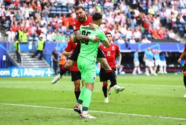 Guram Kashia of Georgia and Giorgi Mamardashvili of Georgia celebrate Georgia v Czechia, UEFA European Championship, EM, Europameisterschaft 2024, Group F, Football, Volksparkstadion, Hamburg, Germany, 22 Jun 2024 EDITORIAL USE ONLY No use with unauthorised audio, video, data, fixture lists, club league logos or live services. Online in-match use limited to 120 images, no video emulation. No use in betting, games or single club league player publications. Copyright: xKieranxMcManus Shutterstockx 14548025di