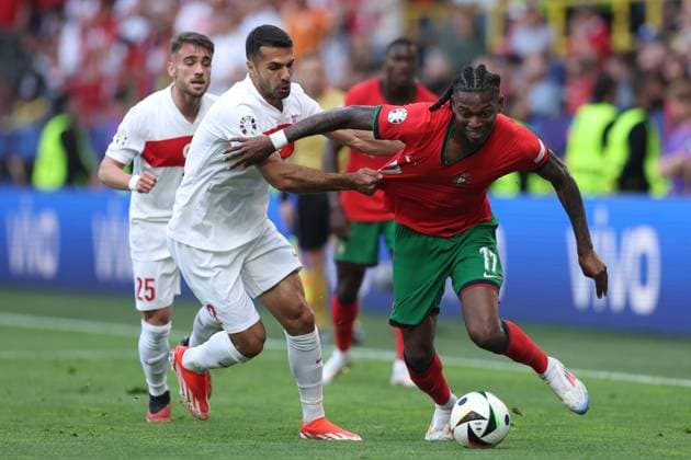 Rafael Leao of Portugal and Zeki Ã?elik of Turkey Turkiye v Portugal, UEFA European Championship, EM, Europameisterschaft 2024, Group F, Football, BVB Stadion, Dortmund, Germany, 22 Jun 2024 EDITORIAL USE ONLY No use with unauthorised audio, video, data, fixture lists, club league logos or live services. Online in-match use limited to 120 images, no video emulation. No use in betting, games or single club league player publications. Copyright: xPaulxCurrie Shutterstockx 14548034cf
