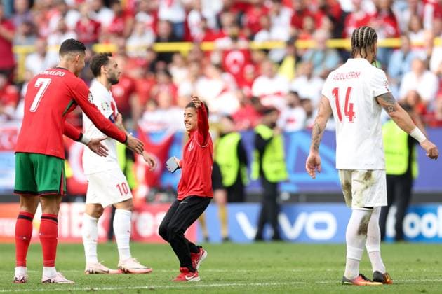 A young fan approach s Cristiano Ronaldo of Portugal during the match to take a selfie Turkiye v Portugal, UEFA European Championship, EM, Europameisterschaft 2024, Group F, Football, BVB Stadion, Dortmund, Germany, 22 Jun 2024 EDITORIAL USE ONLY No use with unauthorised audio, video, data, fixture lists, club league logos or live services. Online in-match use limited to 120 images, no video emulation. No use in betting, games or single club league player publications. Copyright: xPaulxCurrie Shutterstockx 14548034ek