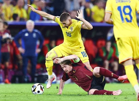 Razvan Marin of Romania and Kevin De Bruyne of Belgium Belgium v Romania, UEFA European Championship, EM, Europameisterschaft 2024, Group E, Football, Cologne Stadium, Cologne, Germany, 22 Jun 2024 EDITORIAL USE ONLY No use with unauthorised audio, video, data, fixture lists, club league logos or live services. Online in-match use limited to 120 images, no video emulation. No use in betting, games or single club league player publications. Copyright: xMichaelxZemanek Shutterstockx 14548045bl