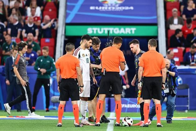 Dominik Szoboszlai of Hungary and Andrew Robertson of Scotland do the coin toss with officials prior to the match Scotland v Hungary, UEFA European Championship, EM, Europameisterschaft 2024, Group A, Football, Stuttgart Arena, Stuttgart, Germany, 23 Jun 2024 EDITORIAL USE ONLY No use with unauthorised audio, video, data, fixture lists, club league logos or live services. Online in-match use limited to 120 images, no video emulation. No use in betting, games or single club league player publications. Copyright: xMichaelxZemanek Shutterstockx 14548075o