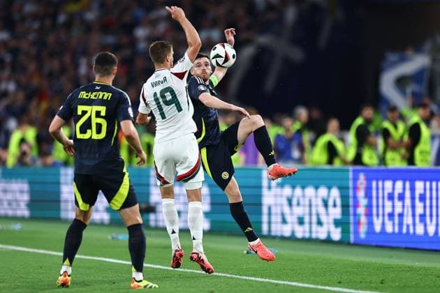 Andrew Robertson of Scotland and Barnabas Varga of Hungary Scotland v Hungary, UEFA European Championship, EM, Europameisterschaft 2024, Group A, Football, Stuttgart Arena, Stuttgart, Germany, 23 Jun 2024 EDITORIAL USE ONLY No use with unauthorised audio, video, data, fixture lists, club league logos or live services. Online in-match use limited to 120 images, no video emulation. No use in betting, games or single club league player publications. Copyright: xMichaelxZemanek Shutterstockx 14548075w