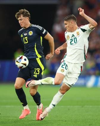 Jack Hendry of Scotland and Roland Sallai of Hungary Scotland v Hungary, UEFA European Championship, EM, Europameisterschaft 2024, Group A, Football, Stuttgart Arena, Stuttgart, Germany, 23 Jun 2024 EDITORIAL USE ONLY No use with unauthorised audio, video, data, fixture lists, club league logos or live services. Online in-match use limited to 120 images, no video emulation. No use in betting, games or single club league player publications. Copyright: xKieranxMcManus Shutterstockx 14548072am