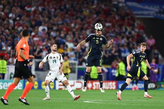 Grant Hanley of Scotland wins a header Scotland v Hungary, UEFA European Championship, EM, Europameisterschaft 2024, Group A, Football, Stuttgart Arena, Stuttgart, Germany, 23 Jun 2024 EDITORIAL USE ONLY No use with unauthorised audio, video, data, fixture lists, club league logos or live services. Online in-match use limited to 120 images, no video emulation. No use in betting, games or single club league player publications. Copyright: xMichaelxZemanek Shutterstockx 14548075ac