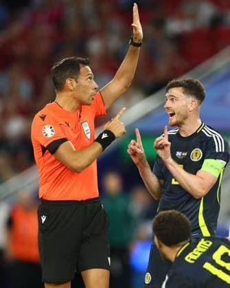 Andrew Robertson of Scotland talks with referee Facundo Tello Scotland v Hungary, UEFA European Championship, EM, Europameisterschaft 2024, Group A, Football, Stuttgart Arena, Stuttgart, Germany, 23 Jun 2024 EDITORIAL USE ONLY No use with unauthorised audio, video, data, fixture lists, club league logos or live services. Online in-match use limited to 120 images, no video emulation. No use in betting, games or single club league player publications. Copyright: xKieranxMcManus Shutterstockx 14548072au