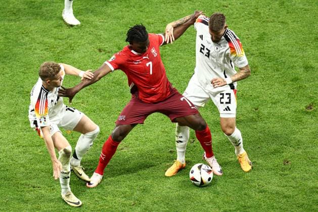 Breel Embolo of Switzerland holds off Maximilian Mittelstädt of Germany and Robert Andrich Switzerland v Germany, UEFA European Championship, EM, Europameisterschaft 2024, Group A, Football, Frankfurt Arena, Frankfurt am Main, Germany, 23 Jun 2024 EDITORIAL USE ONLY No use with unauthorised audio, video, data, fixture lists, club league logos or live services. Online in-match use limited to 120 images, no video emulation. No use in betting, games or single club league player publications. Copyright: xMattxWest Shutterstockx 14548071bl