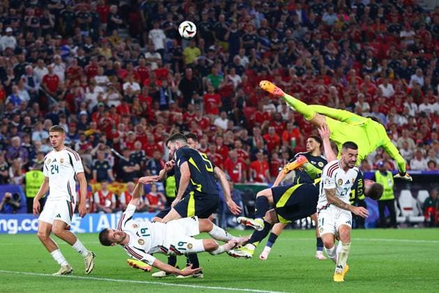 Angus Gunn of Scotland comes for the ball and Barnabas Varga of Hungary is injured in the process Scotland v Hungary, UEFA European Championship, EM, Europameisterschaft 2024, Group A, Football, Stuttgart Arena, Stuttgart, Germany, 23 Jun 2024 EDITORIAL USE ONLY No use with unauthorised audio, video, data, fixture lists, club league logos or live services. Online in-match use limited to 120 images, no video emulation. No use in betting, games or single club league player publications. Copyright: xMichaelxZemanek Shutterstockx 14548075az