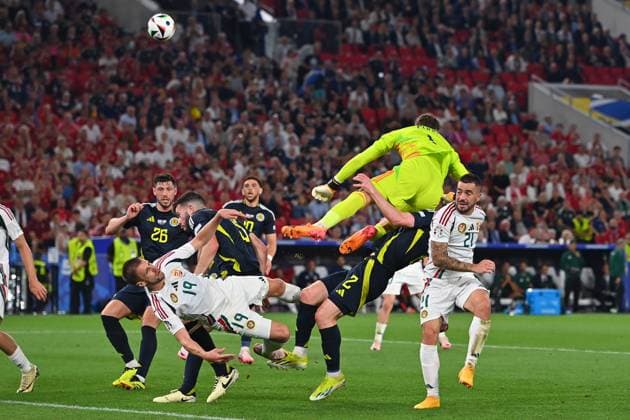 Zusammenprall Barnabas VARGA (19,HUN) mit Torwart Angus GUNN (Schottland), Strafraumszene. Ohnmacht,K.O.Aktion,Zweikampf. re:Endre BOTKA (HUN), Anthony RALSTON (Schottland), Gruppenphase Gruppe A Schottland (SCO) - Ungarn (HUN) 0-1, am 23.06.2024, Stuttgart Arena. Fussball UEFA EURO, EM, Europameisterschaft,Fussball 2024 GERMANY vom 14.06.2024 - 14.07.2024.