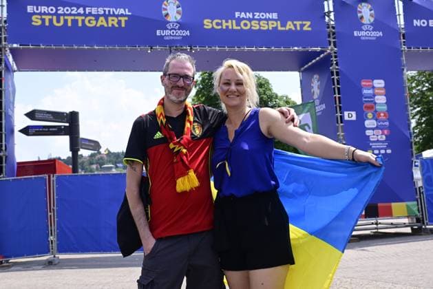 Belgian-Ukrainian couple Bjorn and Viktoria pictured in the city center, near the fan zone village, in the afternoon before a soccer game between Ukraine and Belgian national soccer team Red Devils, Wednesday 26 June 2024 in Stuttgart, Germany, the third match in the group stage of the UEFA EURO, EM, Europameisterschaft,Fussball 2024 European championships. In the group E, the four teams have three points before the last game, it is the first time this happens at Euro. DIRKxWAEM x95301504x