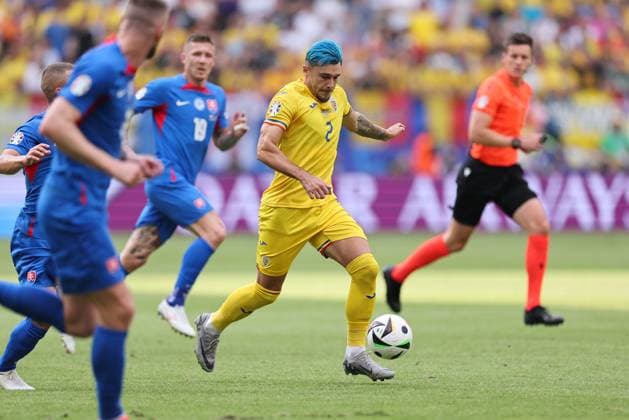 26.06.2024, Fussball Europameisterschaft, UEFA EURO, EM, Europameisterschaft,Fussball 2024, Slowakei - Rumänien, Gruppe E, Arena Frankfurt, v.l., Andrei Florin Ratiu (Rumänien) Copyright: HMBxMedia