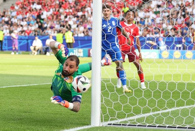 Goalkeeper Gianluigi Donnarumma of Italy saves a free kick Switzerland v Italy, UEFA European Championship, EM, Europameisterschaft 2024, Round of 16, Football, Olympiastadion, Berlin, Germany - 29 Jun 2024 EDITORIAL USE ONLY No use with unauthorised audio, video, data, fixture lists, club league logos or live services. Online in-match use limited to 120 images, no video emulation. No use in betting, games or single club league player publications. Copyright: xPaulxCurrie Shutterstockx 14562043bk