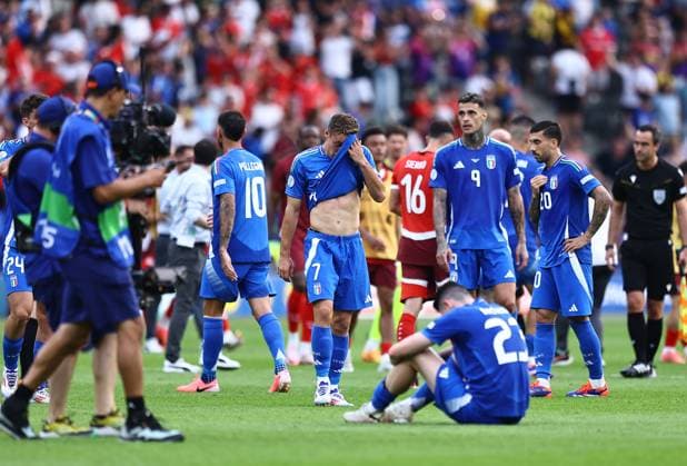 Alessandro Bastoni and Davide Frattesi of Italy look dejected at the end of the game Switzerland v Italy, UEFA European Championship, EM, Europameisterschaft 2024, Round of 16, Football, Olympiastadion, Berlin, Germany - 29 Jun 2024 EDITORIAL USE ONLY No use with unauthorised audio, video, data, fixture lists, club league logos or live services. Online in-match use limited to 120 images, no video emulation. No use in betting, games or single club league player publications. Copyright: xMichaelxZemanek Shutterstockx 14562039bw