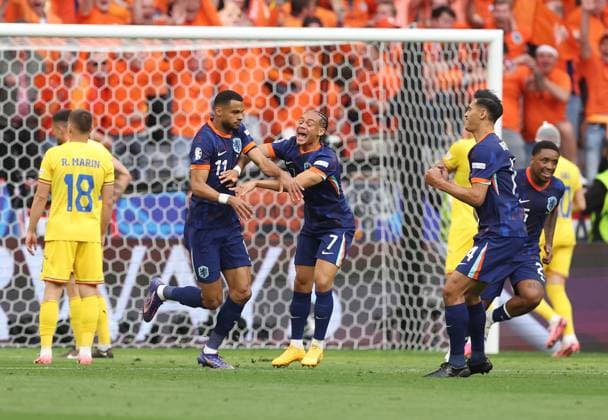 Cody Gakpo of Netherlands celebrates scoring to make it 0-1 with Xavi Simons of Netherlands Romania v Netherlands, UEFA European Championship, EM, Europameisterschaft 2024, Round of 16, Football, Munich Football Arena, Munich, Germany - 02 Jul 2024 EDITORIAL USE ONLY No use with unauthorised audio, video, data, fixture lists, club league logos or live services. Online in-match use limited to 120 images, no video emulation. No use in betting, games or single club league player publications. Copyright: xPaulxCurrie Shutterstockx 14566647ba