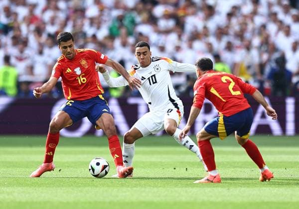 Rodri of Spain is challenged by Jamal Musiala of Germany Spain v Germany, UEFA European Championship, EM, Europameisterschaft 2024, Quarter Final, Football, Stuttgart Arena, Stuttgart, Germany, 05 Jul 2024 EDITORIAL USE ONLY No use with unauthorised audio, video, data, fixture lists, club league logos or live services. Online in-match use limited to 120 images, no video emulation. No use in betting, games or single club league player publications. Copyright: xMichaelxZemanek Shutterstockx 14571380aq