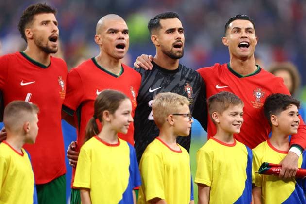 Cristiano Ronaldo of Portugal and team mates sing the national anthem Portugal v France, UEFA European Championship, EM, Europameisterschaft 2024, Quarter Final, Football, Volksparkstadion, Hamburg, Germany, 05 Jul 2024 EDITORIAL USE ONLY No use with unauthorised audio, video, data, fixture lists, club league logos or live services. Online in-match use limited to 120 images, no video emulation. No use in betting, games or single club league player publications. Copyright: xKieranxMcManus Shutterstockx 14571382y