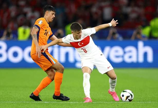 Tijjani Reijnders of Netherlands and Arda Güler of Türkiye Netherlands v Turkiye, UEFA European Championship, EM, Europameisterschaft 2024, Quarter Final, Football, Olympiastadion, Berlin, Germany, 06 Jul 2024 EDITORIAL USE ONLY No use with unauthorised audio, video, data, fixture lists, club league logos or live services. Online in-match use limited to 120 images, no video emulation. No use in betting, games or single club league player publications. Copyright: xKieranxMcManus Shutterstockx 14571393be