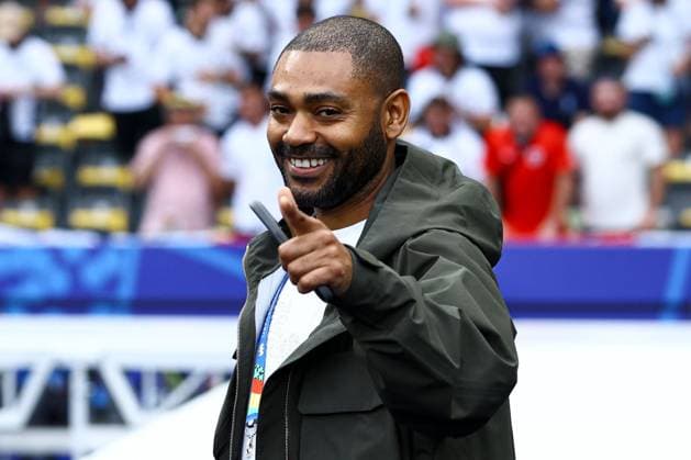British rapper Kano pitchside before the game Spain v England, UEFA European Championship, EM, Europameisterschaft 2024, Final, Football, Olympiastadion, Berlin, Germany, 14 Jul 2024 EDITORIAL USE ONLY No use with unauthorised audio, video, data, fixture lists, club league logos or live services. Online in-match use limited to 120 images, no video emulation. No use in betting, games or single club league player publications. Copyright: xKieranxMcManus Shutterstockx 14583341al