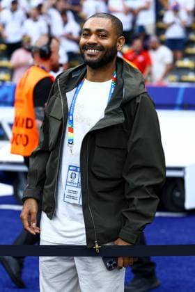 British rapper Kano pitchside before the game Spain v England, UEFA European Championship, EM, Europameisterschaft 2024, Final, Football, Olympiastadion, Berlin, Germany, 14 Jul 2024 EDITORIAL USE ONLY No use with unauthorised audio, video, data, fixture lists, club league logos or live services. Online in-match use limited to 120 images, no video emulation. No use in betting, games or single club league player publications. Copyright: xKieranxMcManus Shutterstockx 14583341am