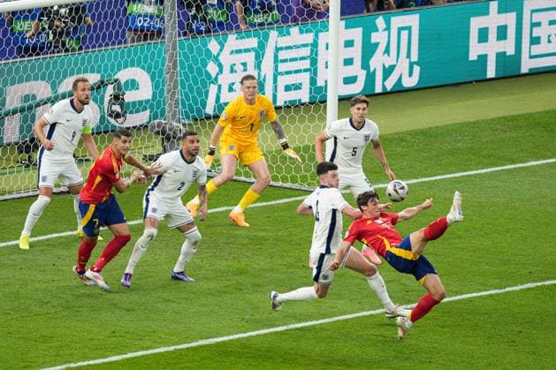 England players defend an attempted overhead kick from Robin Le Normand of Spain Spain v England, UEFA European Championship, EM, Europameisterschaft 2024, Final, Football, Olympiastadion, Berlin, Germany, 14 Jul 2024 EDITORIAL USE ONLY No use with unauthorised audio, video, data, fixture lists, club league logos or live services. Online in-match use limited to 120 images, no video emulation. No use in betting, games or single club league player publications. Copyright: xDavexShopland Shutterstockx 14583342ci